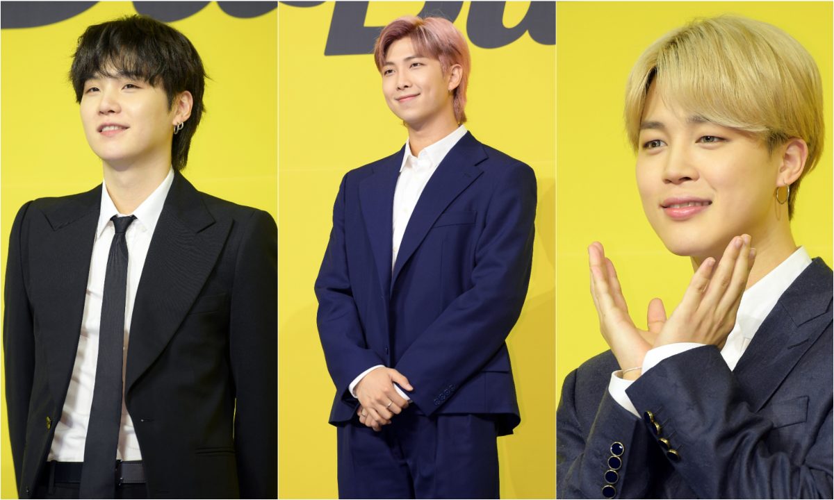 Une photo jointe de Suga, RM et Jimin de BTS lors de la conférence de presse du groupe pour 