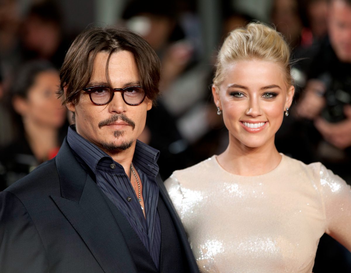 Johnny Depp et Amber Heard, qui vivaient dans le penthouse de Los Angeles lorsqu'ils étaient mariés, posent ensemble sur le tapis lors de la première européenne de 