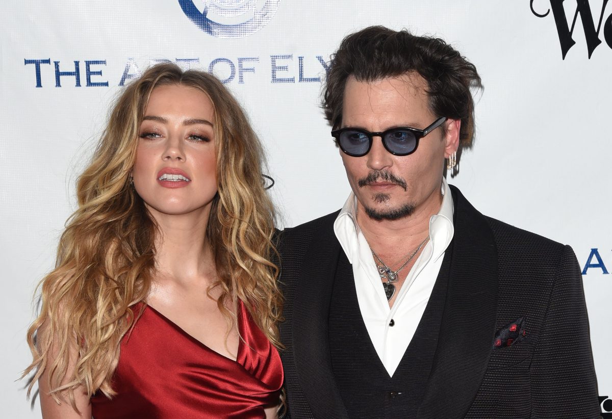 Amber Heard et Johnny Depp, pour qui le célèbre chef Leon Rothera a cuisiné, souriant sur le tapis au gala The Art of Elysium 2016 HEAVEN