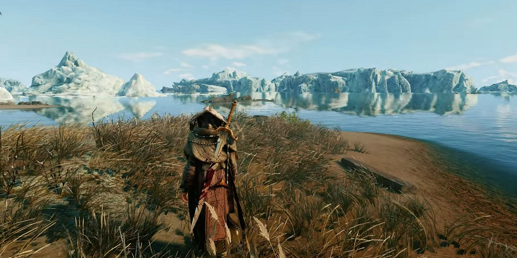 Image de Skyrim montrant le joueur regardant dans un plan d'eau avec une toundra glacée au loin.