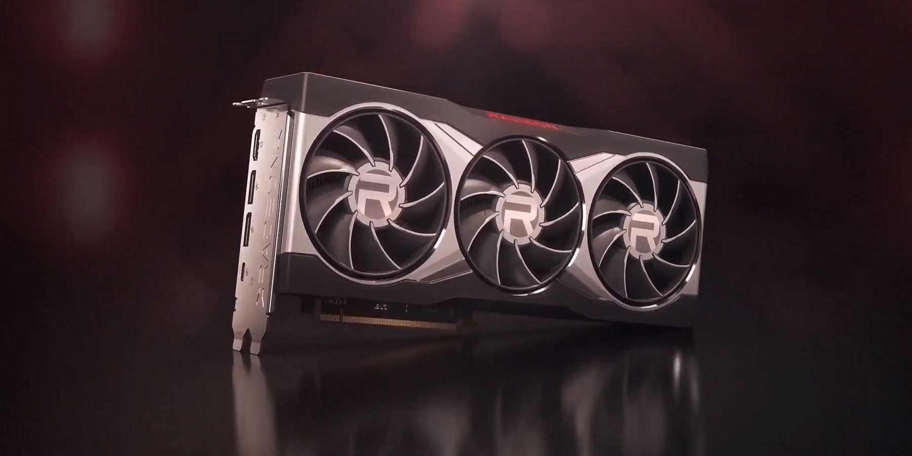 Image d'une carte graphique AMD Radeon sur fond rouge foncé.