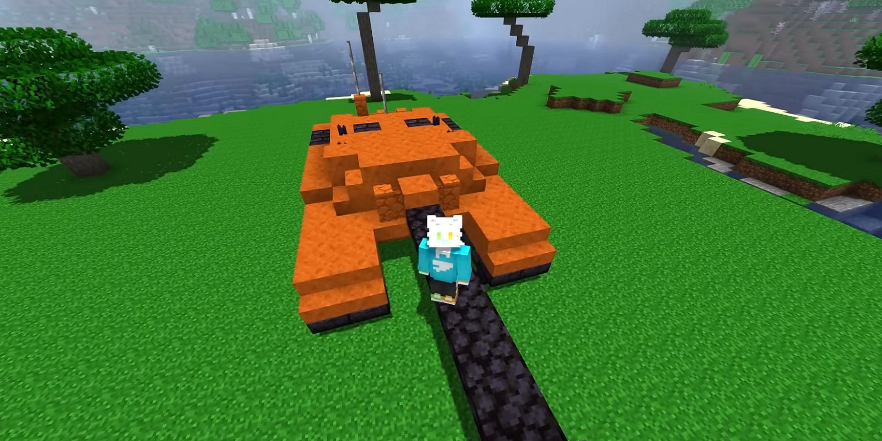Image de Minecraft montrant le joueur planant au-dessus d'un réservoir orange.