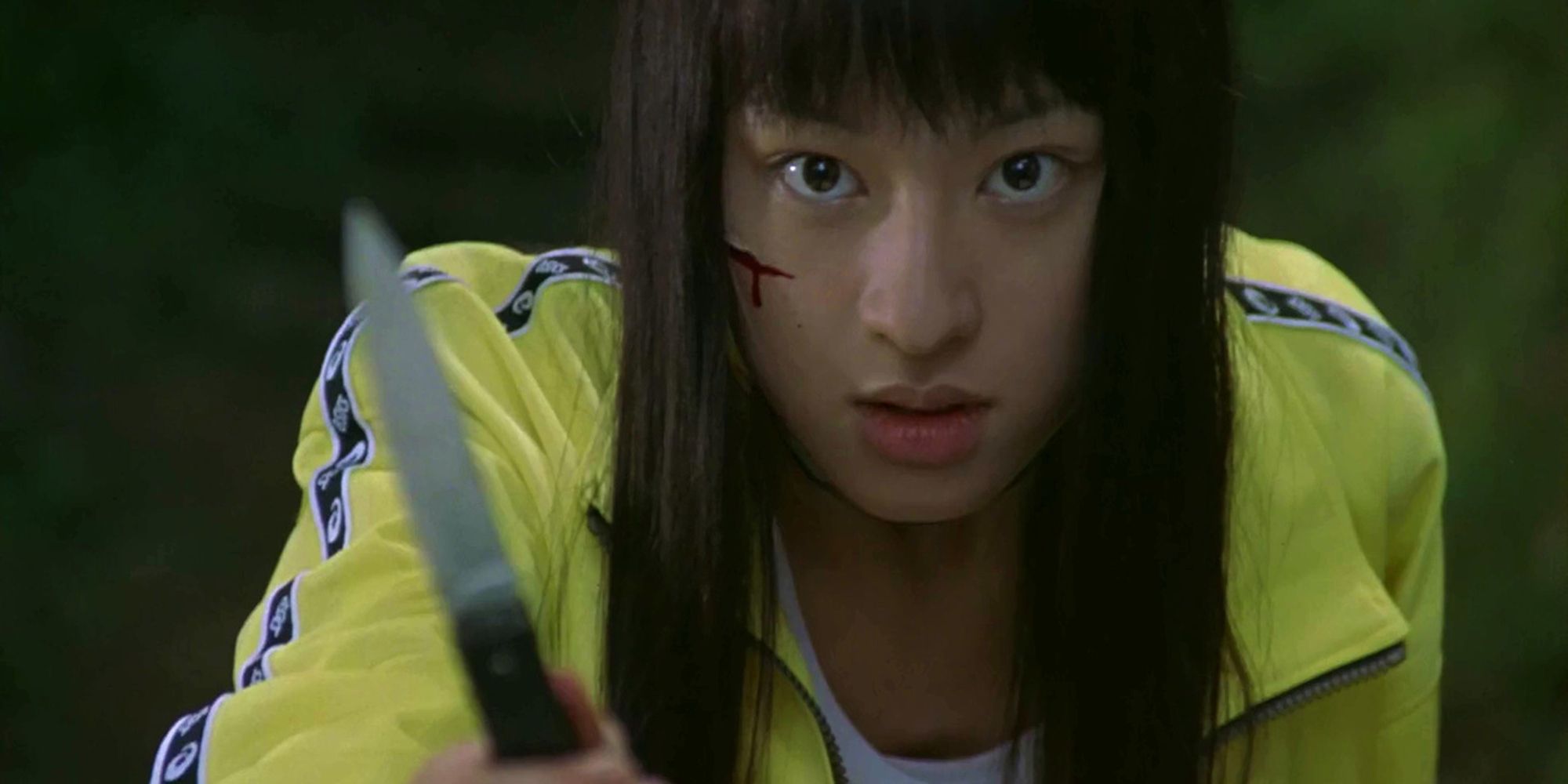 Chiaki Kuriyama tenant un couteau dans Battle Royale